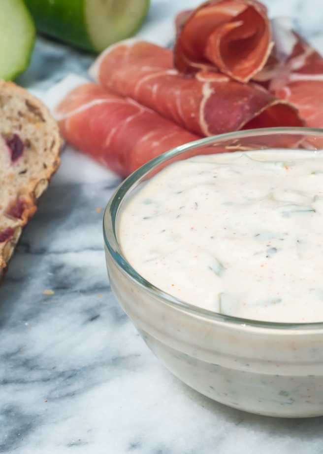 The original Greek Tzatziki recipe, with added dill, is a perfect sauce for any grilled meats or to be used as a dip but how about with a twist? A little swap and some addition can take this classic into totally new levels – it is still mellow thanks to the Greek yogurt but with the addition of mint and a few spicy chillies it will now offer a tangy finish with a little bit of a kick. When I was making it for the first time I had no idea it would work out so well. The smoked paprika gives a very unique flavour especially when combined with the mint and hot chillies. It’s still Tzatziki-like just different, I would call it Tzatziki 2.0 :-)