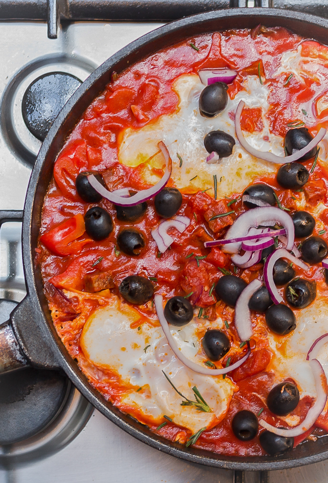Eggs baked on top of a rich tomato based sauce topped with olives and parsley… a wonderful flavour combination, which is perfect any time of the day. 